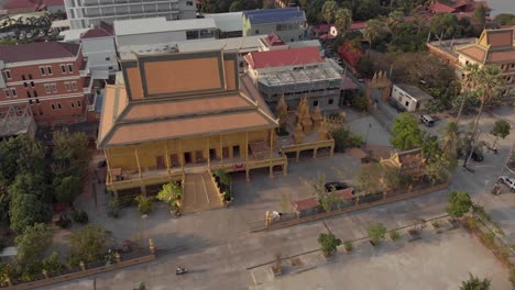 top view of golden temple of phnom penh in cambodia - aerial orbit point of interest shot