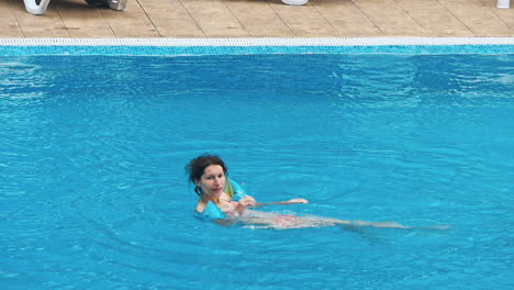 happy family having fun in the swimming pool.
