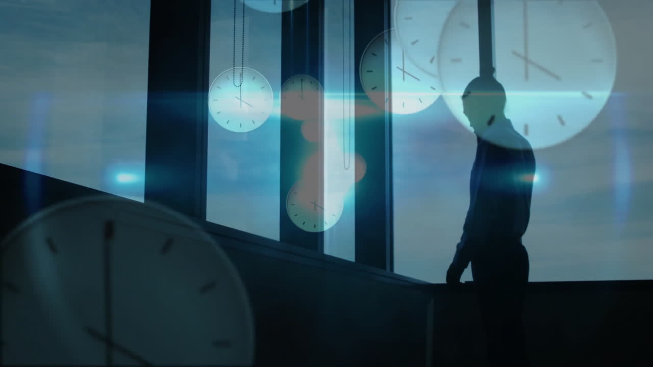 Floating clock animations by window, silhouette of person standing quietly