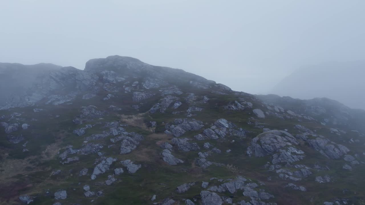 Misty Norwegian Fjord Landscape with Rugged Mountains