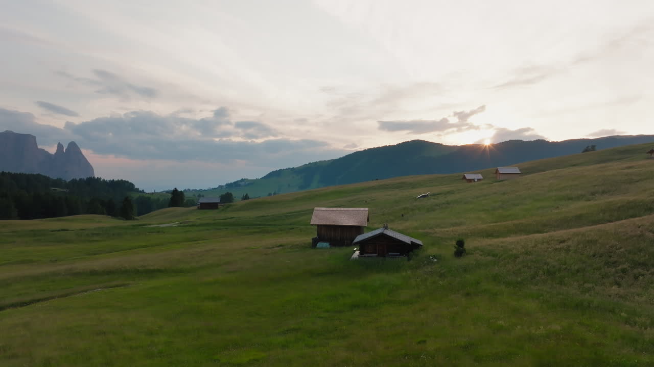 Stunning sunset in Alpe di Siusi in spring, Aerial View Video, Dolomites, Italian Alps