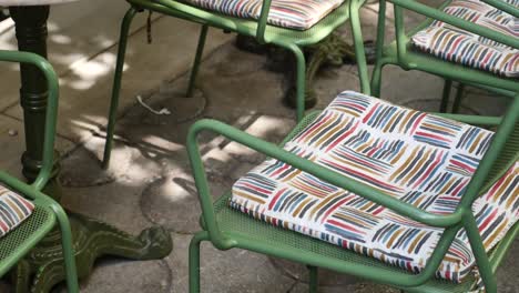 outdoor cafe chairs with colorful cushions