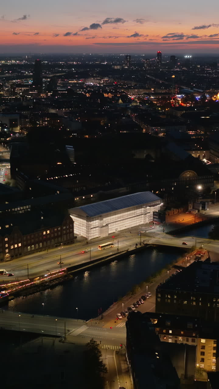 Aerial drone view of Knippel bascule bridge in Copenhagen, Denmark at night. Vertical