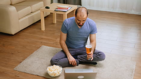 excited man holding a beer glass