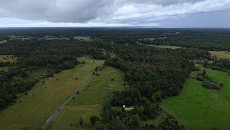 Aerial-of-beautiful-green-countryside-with-overcast-weather