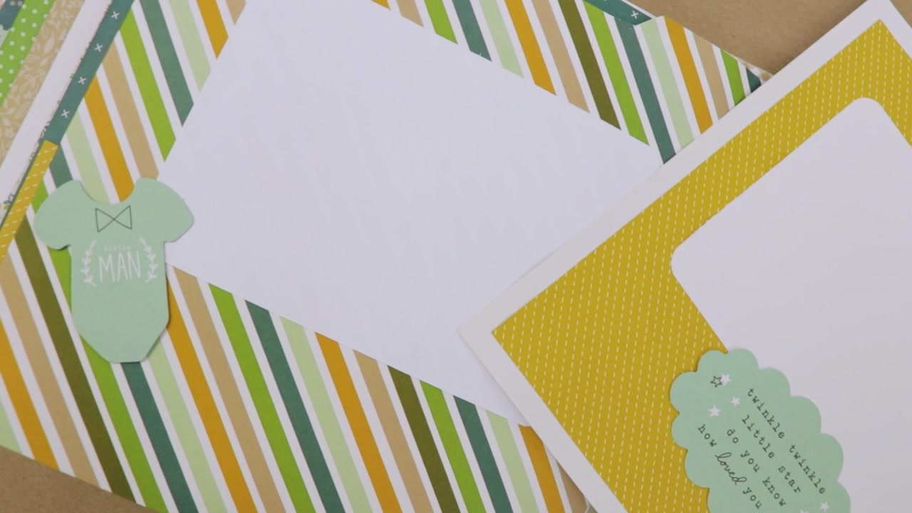 Pagine di scrapbook colorate a tema neonato con motivi, animali e un dolce messaggio