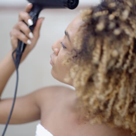 attractive girl dries hair