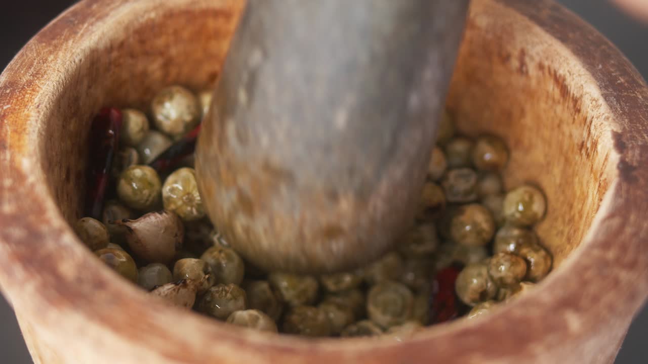 Using a Mortar and Pestle to Crush Chilies, Garlic and Green Peppercorns