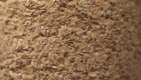 close up shot of spinning healthy granola cereal in glass lighting by light in studio