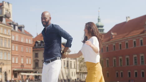 interracial couple dancing salsa in the old town street 2