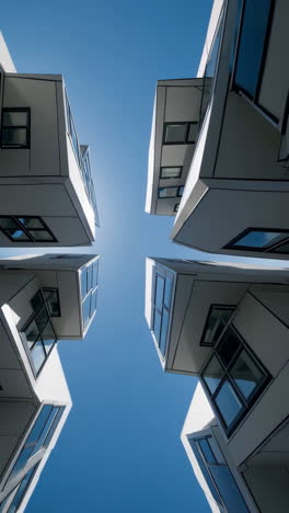 modern architectural buildings against a clear blue sky
