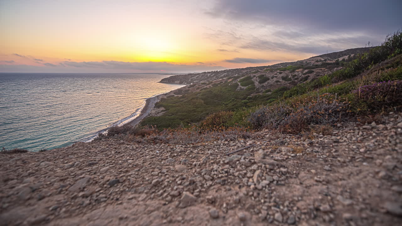 Witness an invigorating sunrise at the picturesque beach of Aphrodite&rsquo;s Rock in Cyprus through our captivating time-lapse footage