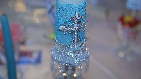 ornate blue candle holder with cross