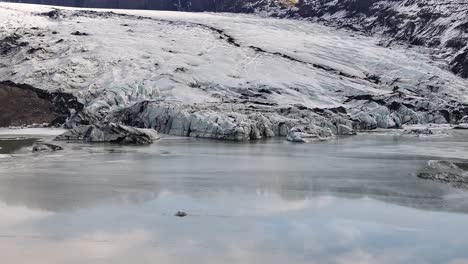 frozen glacier lake aerial sólheimajökull mýrdalsjökull gletscher iceland