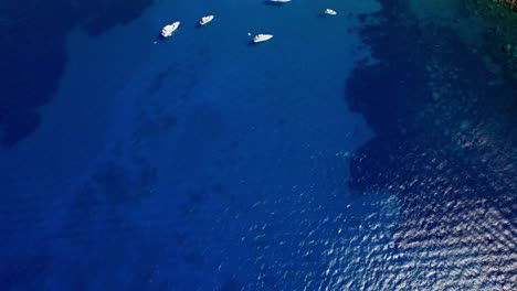 Revealing-shot-of-yacht´s-anchor-on-bay-surround-by-high-mountain-on-Mallorca´s-west-coast