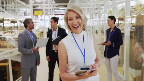 businesswoman standing in a conference foyer