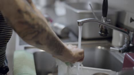 restaurant worker washing hands