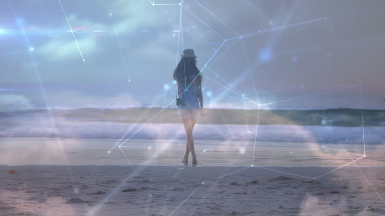 Walking on beach, woman surrounded by animation of digital network connections