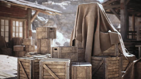 wooden crates covered with a cloth in a rustic outdoor setting during daylight