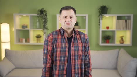 the man was looking at the camera with disgust.