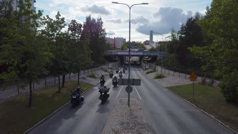 motorcyclists riding on a city road