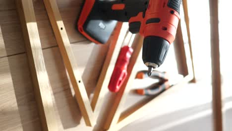 assembling furniture with power drill and screwdriver