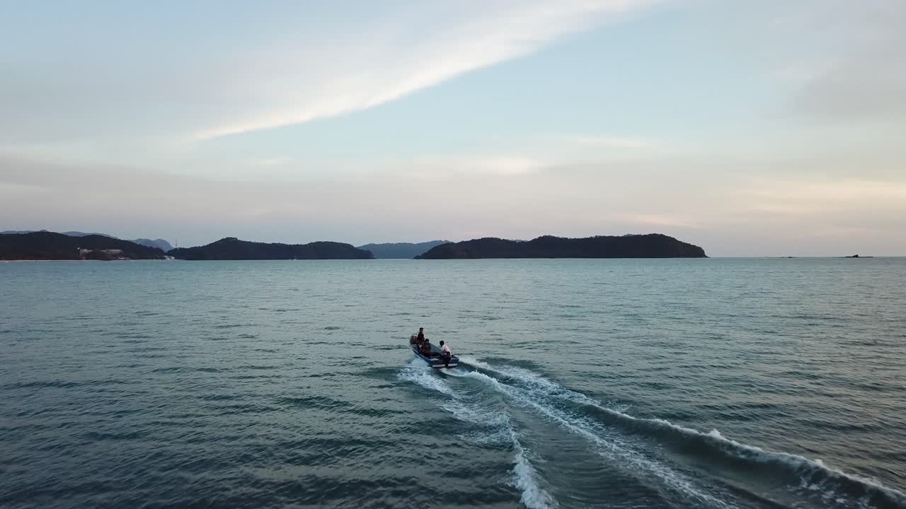 Small Boat on the Ocean at Sunset