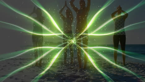 People practicing yoga on beach with green light pattern animation over them