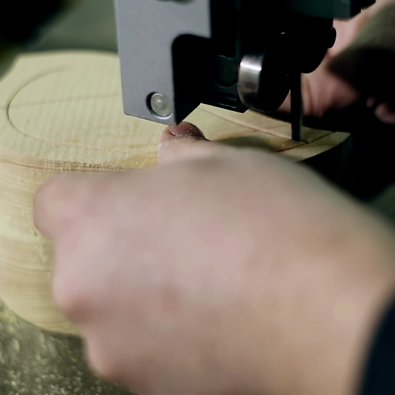Man Uses An Electric Saw To Cut Wooden Planks