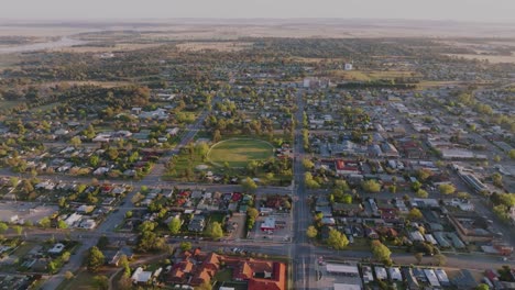 sunrise aerial over a regional australian town on a foggy morning