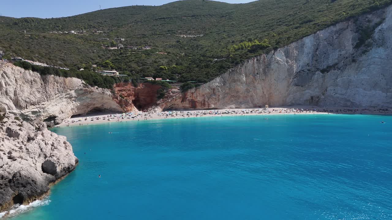 Lefkada,Aerial view backwards from Porto Katsiki beach towards mesmerizing turquoise waters shored by the white sandy beach bordered by steep cliffs covered with greenery.Beautiful nature and colors