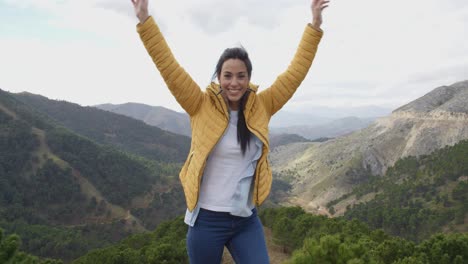 Female-hiker-rejoicing-in-the-mountains