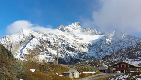 cinematic drone footage of snow covered gotthard mountain in the swiss alps in switzerland