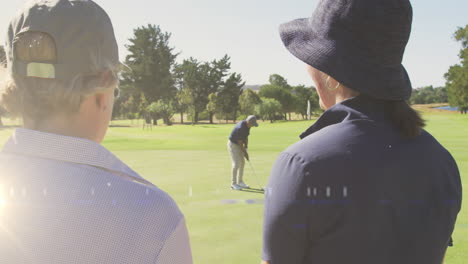 animation of light trails over senior caucasian couple on golf course