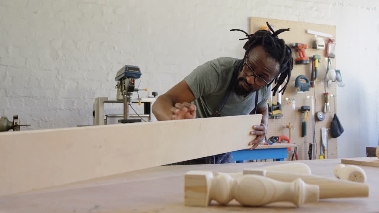 Carpenter measuring wooden plank 4k
