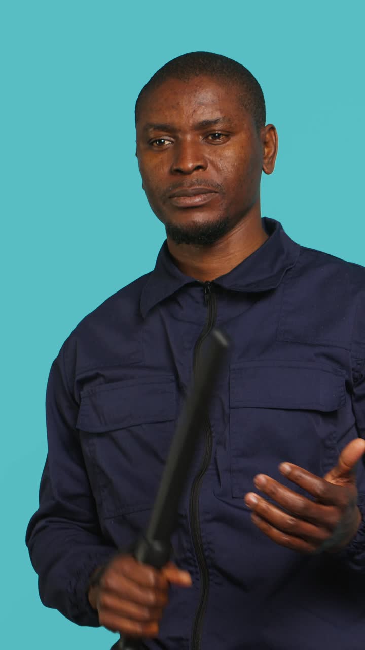 African American Man Demonstrating an Extendable Baton