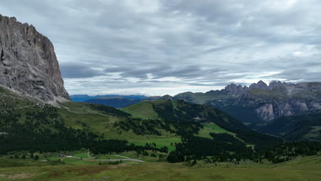 Green-valley-surrounded-with-majestic-Dolomites,-aerial-view