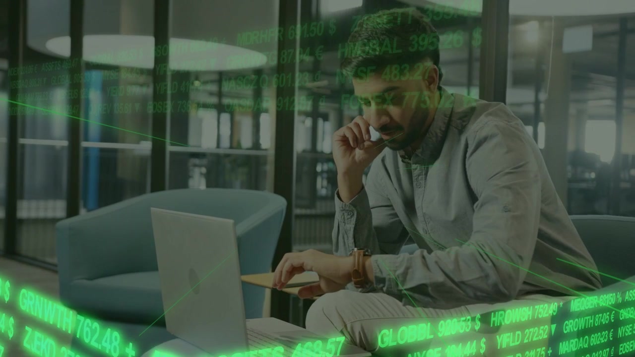 Green finance stream moving across frame urging worker analyzing market lifting phone typing laptop