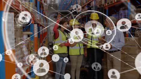 Animation-of-network-of-connections-with-icons-over-people-working-in-warehouse