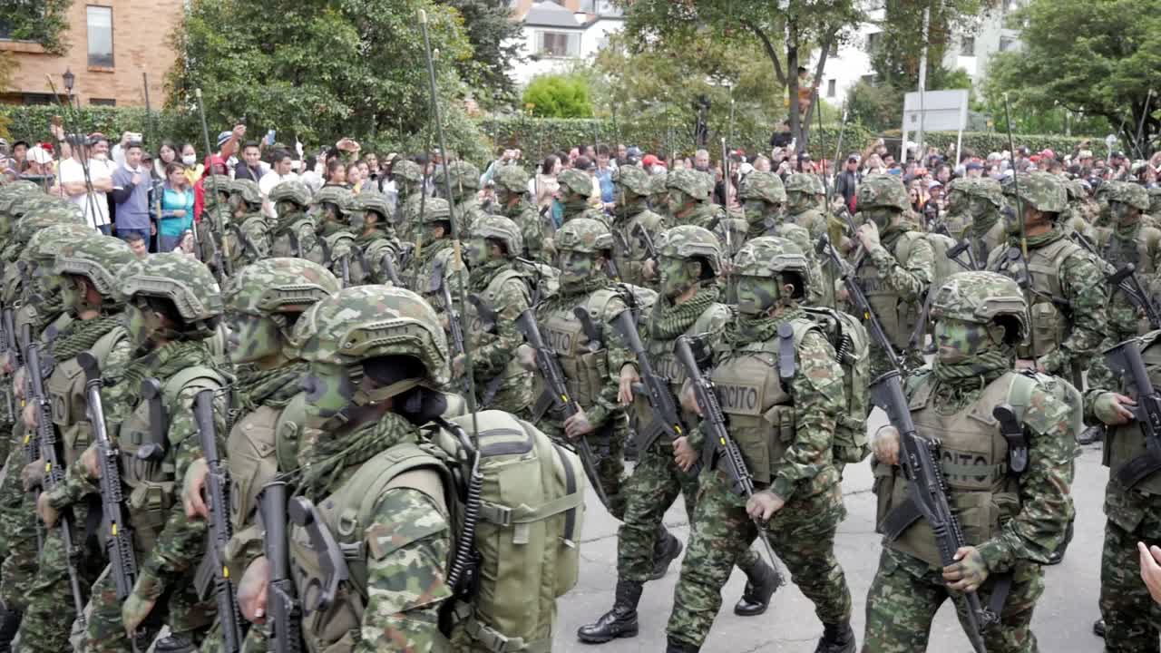 Colombian soldiers with big radios, marching. Military parade. Independence day, July 20th