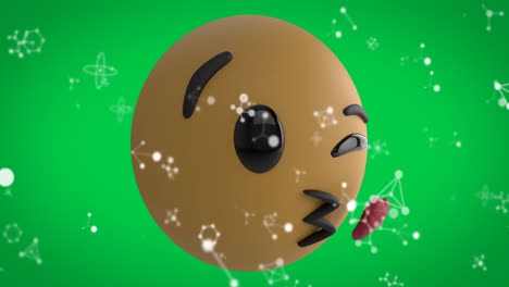 animación digital de estructuras moleculares sobre la cara soplando un emoji de beso volador en un fondo verde