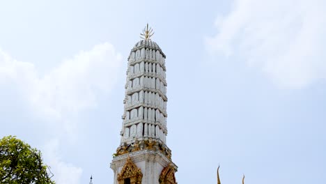 temple spires rise above lush green trees