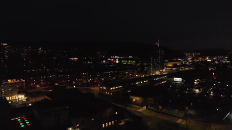 Aerial-View-of-a-city-filled-with-colorful-lights-at-night-time