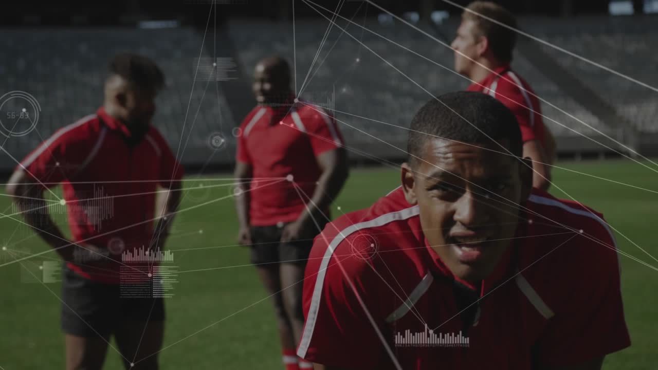 Front athlete reacting to intensifying sports graphics by leaning and straightening and shouting