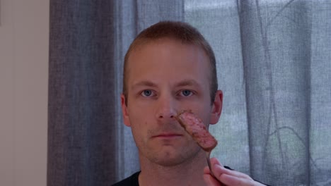 a man eating a meal indoors.