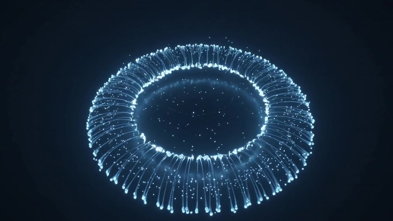Pulsing luminous ring forming filaments when animation starts in dark void, showing inner glow band