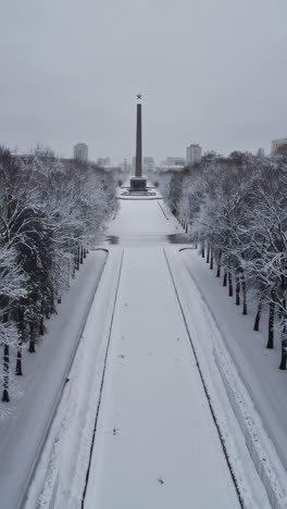 Snowy Winter Scene at a Monument in a City Park