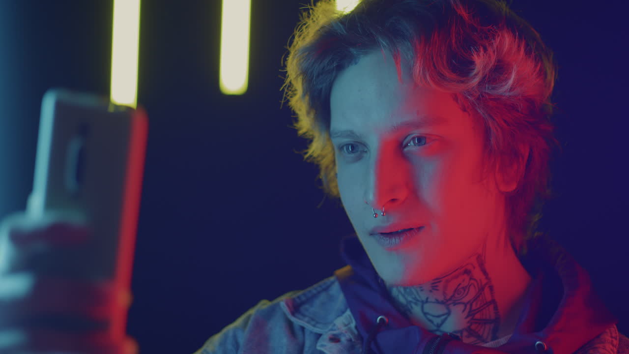 Neon Portrait of a Person Using a Smartphone