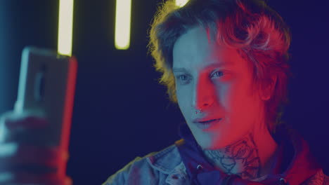 neon portrait of a person using a smartphone
