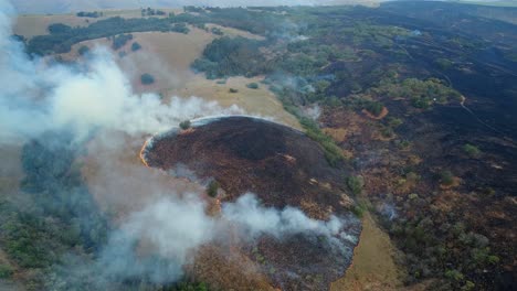 Controlled burn, aerial drone of Prescribed fire in forest of specific area on a farm